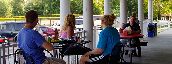 Photo of people eating at the Bacci Park concession stand